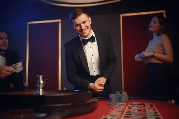 A cheerful woman in traditional clothing using her smartphone during a festive moment, showing how easily the D63 app fits into everyday life.