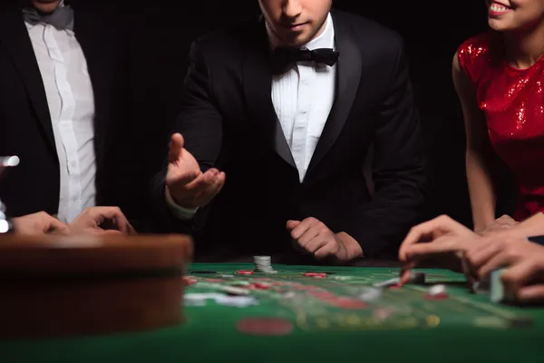 A glowing roulette wheel with cascading chips, symbolizing the engaging live and instant-win games available on D63.